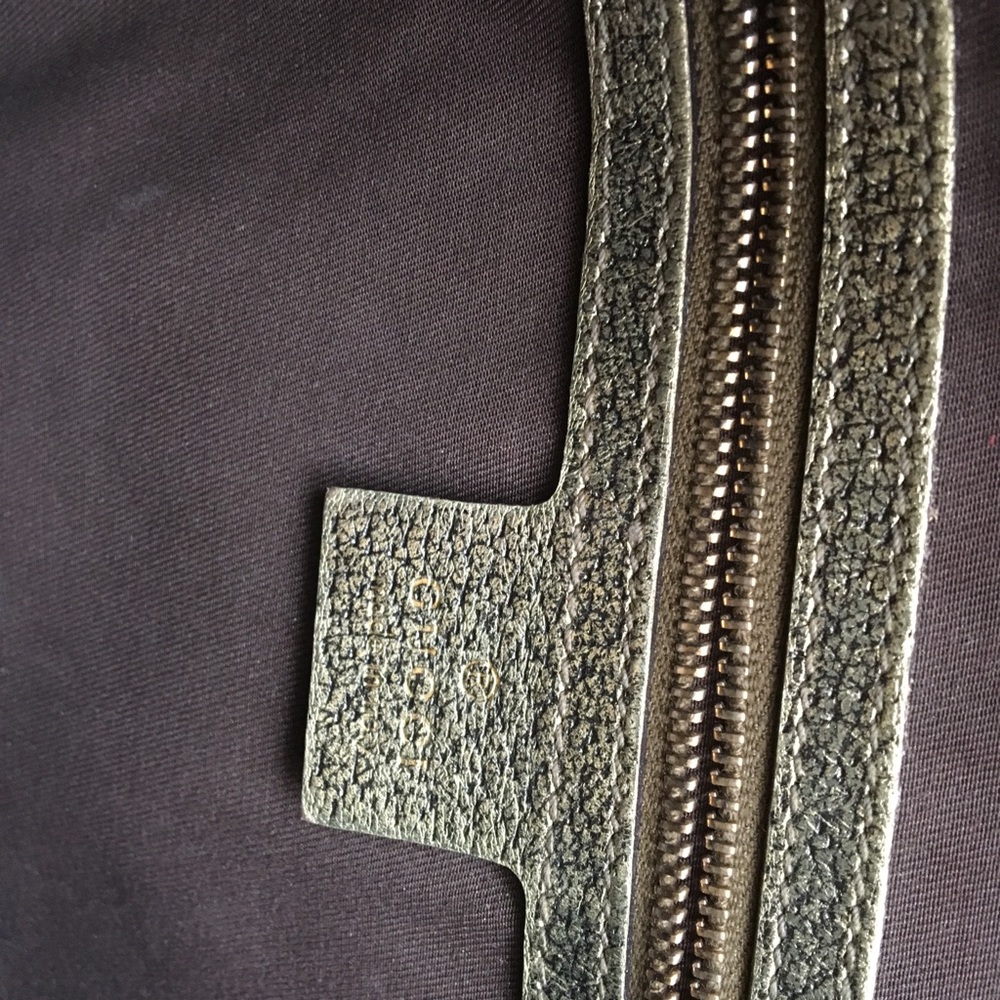 Gucci gold purse gently used